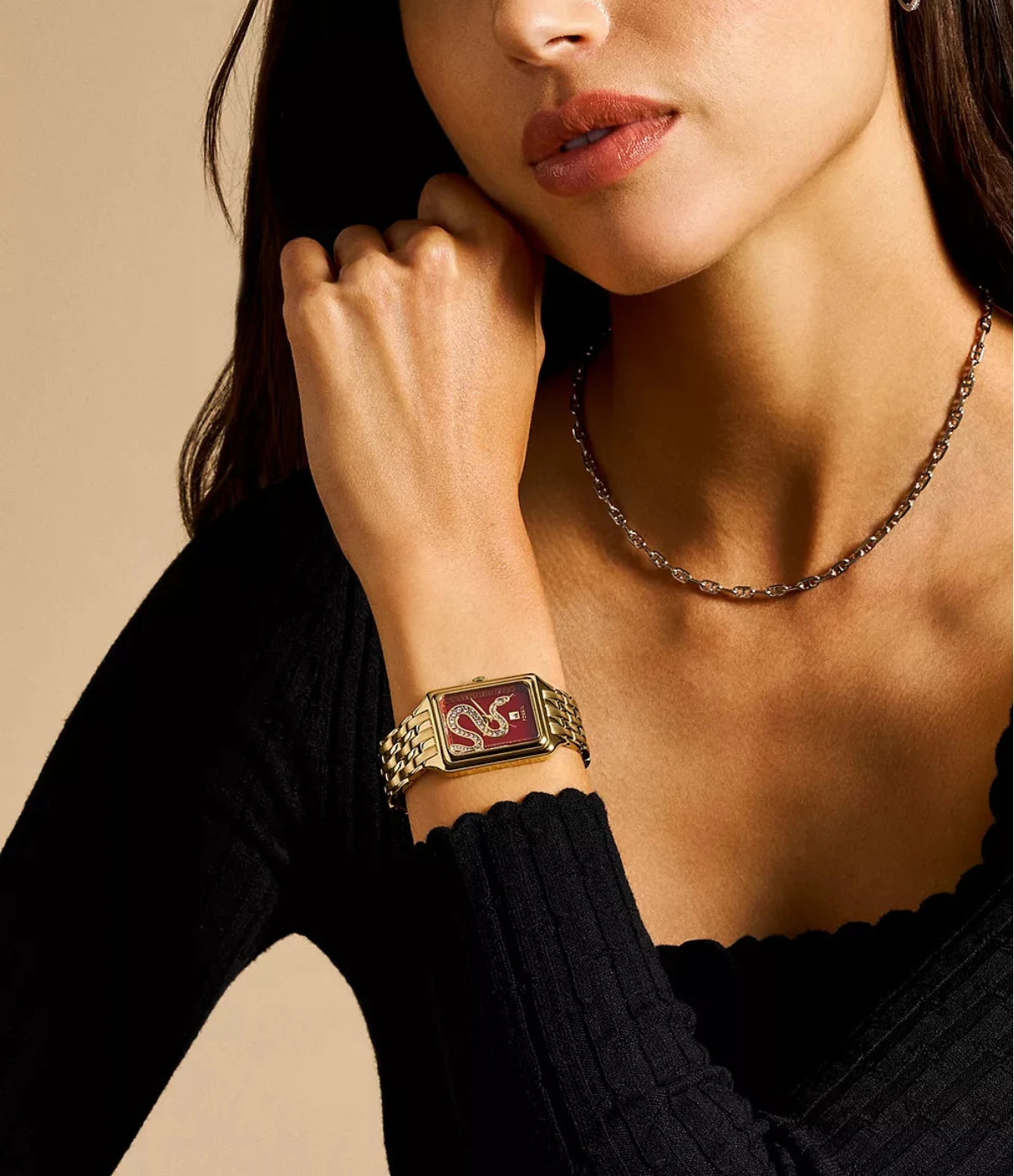 Fossil Raquel 26mm ES5379 worn on the wrist, showing the slim rectangular case and red dial with crystal snake detail