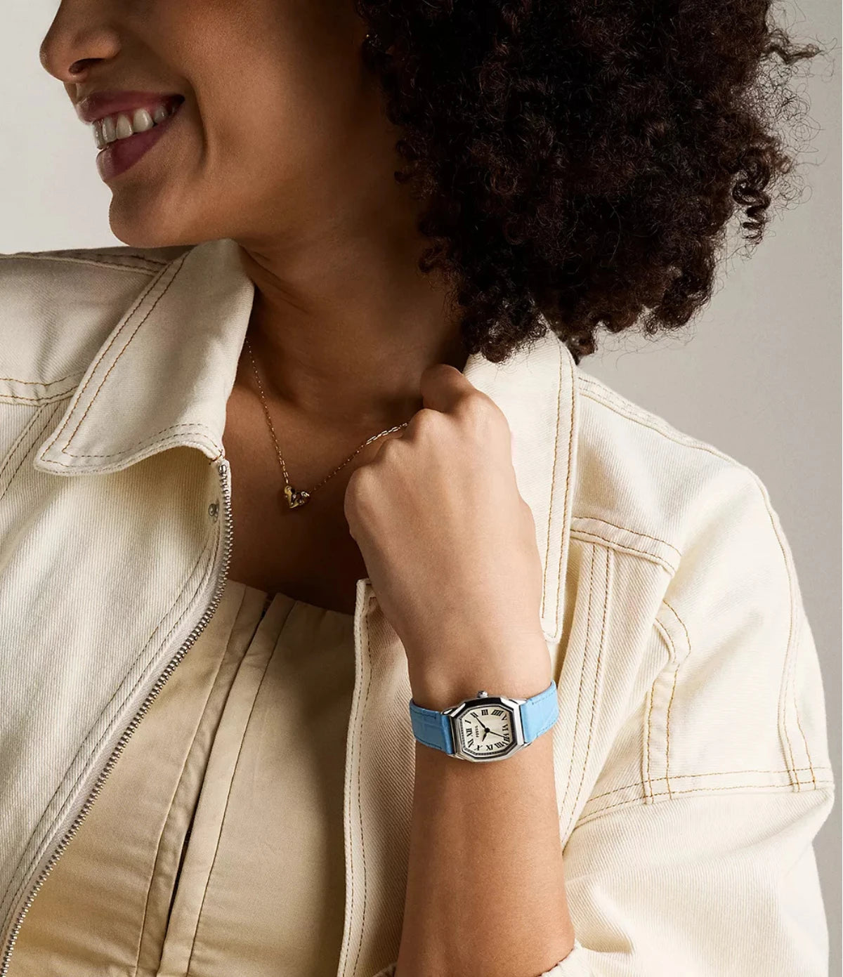 Fossil Harlow 27mm ES5405 worn on the wrist, showing the octagonal case and light blue embossed leather strap