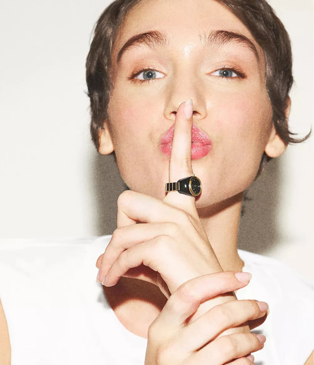 Fossil Watch Ring ES5413 worn on the finger, showing the petite 15mm case and gold-tone expansion band