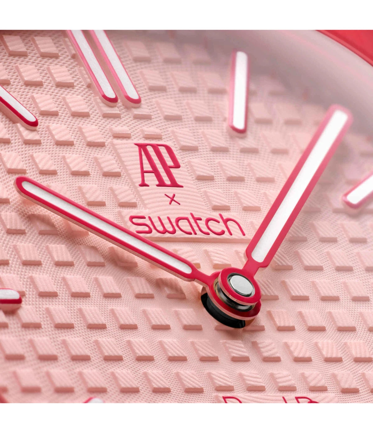 Close-up of the pink tapisserie dial on the Swatch x Audemars Piguet Royal Pop Otto Rosso SSX03R100N showing the AP x Swatch and Royal Pop branding