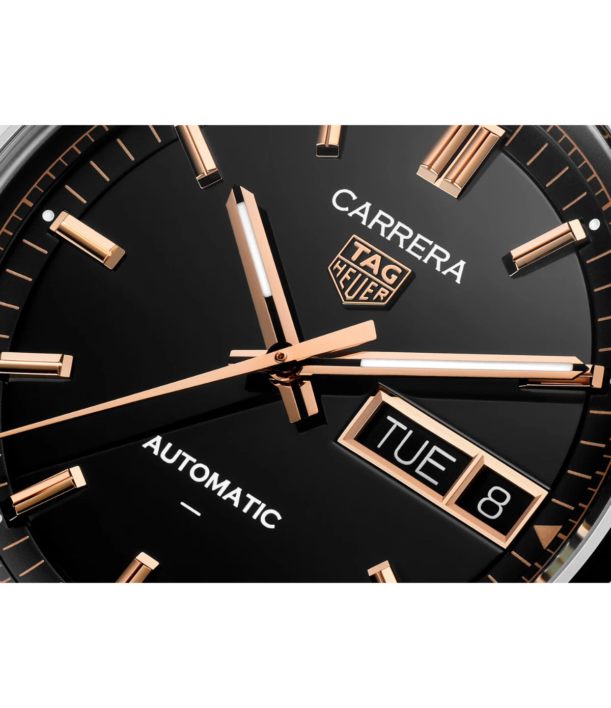Close-up of the black opalin dial on the TAG Heuer Carrera Day-Date WDA2111.BA0043 showing 18K rose gold-plated indexes and hands with day-date display