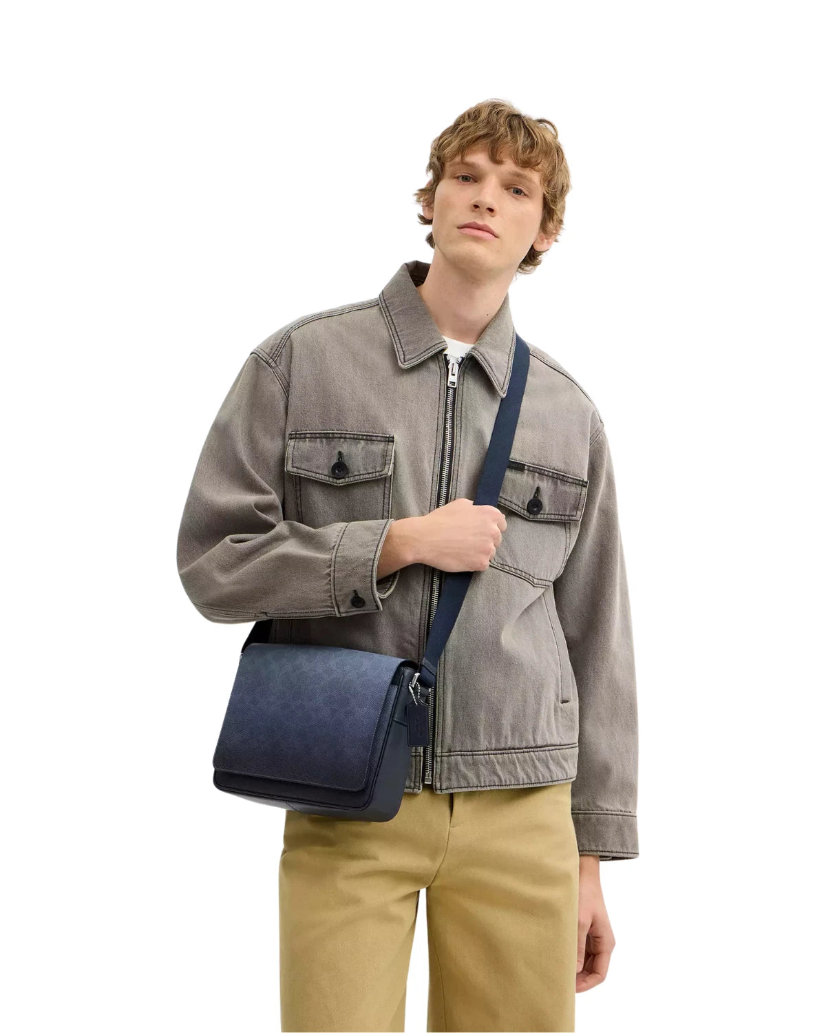 Man wearing the Coach Jack Messenger Bag in Ombre Signature Canvas CDX89 crossbody with adjustable strap, styled for city commuting and everyday use