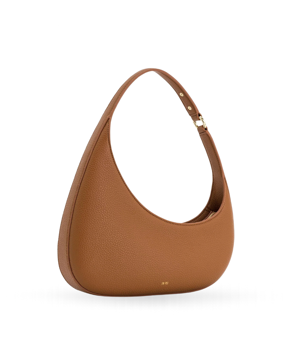 Side profile of the JW PEI Harlee bag in brown, showing its structured silhouette and strap design