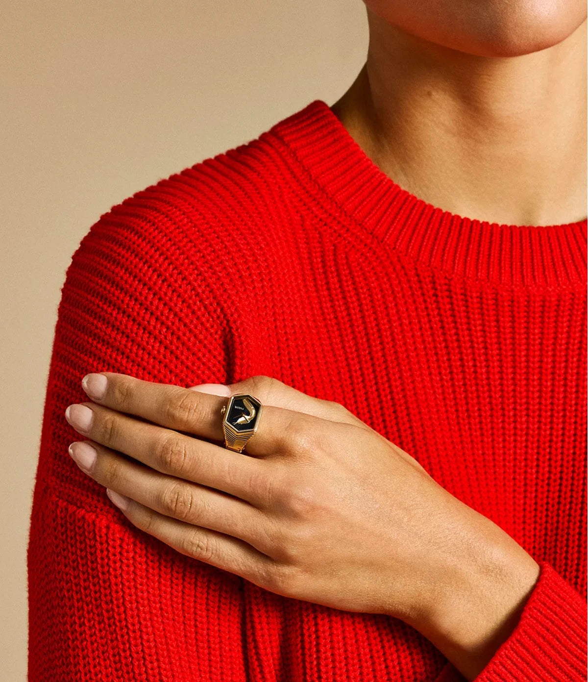 Fossil Watch Ring ES5382 worn on the finger, showing the petite 15mm case and gold-tone snake dial design