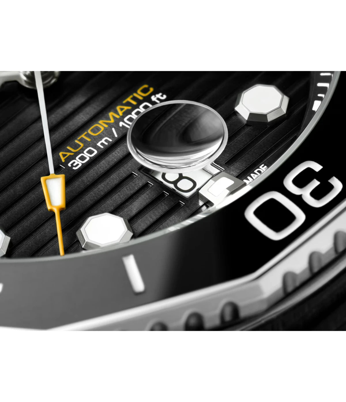 Close-up of the black sunray brushed dial on the TAG Heuer Aquaracer Professional 300 Date WBP201A.FT6197 showing octagonal hour markers with Super-LumiNova