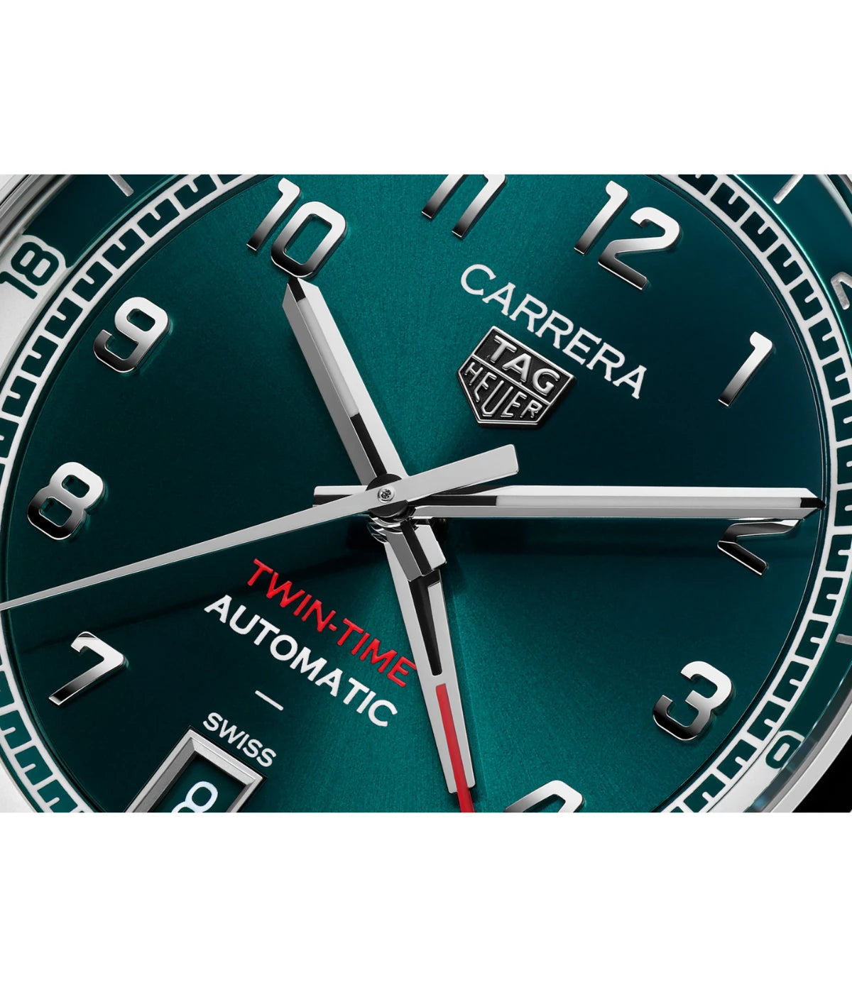Close-up of the sunray-brushed teal green dial on the TAG Heuer Carrera Date Twin-Time WDA2114.BA0043 showing the rhodium-plated GMT hand with red tip