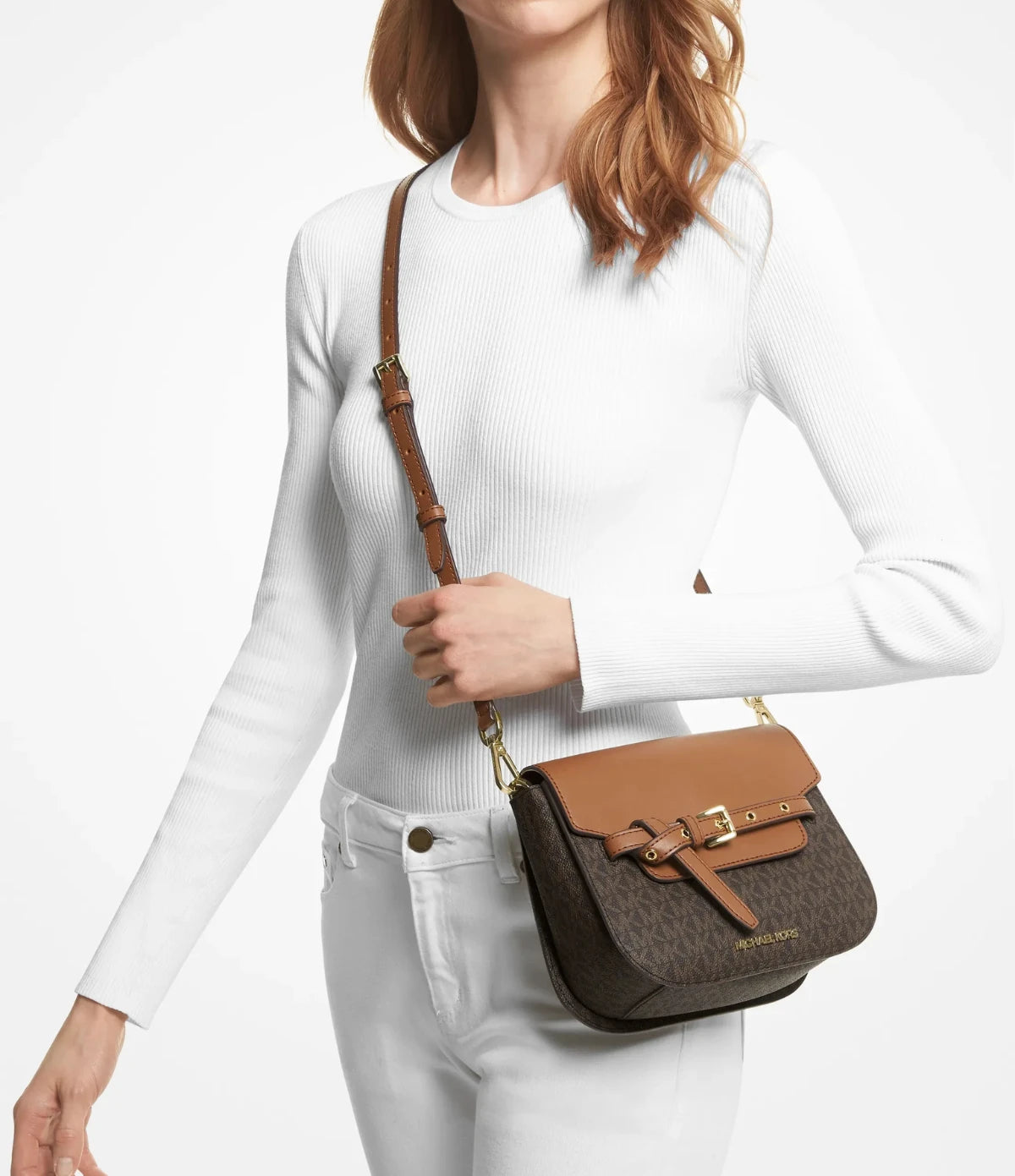 Woman wearing the Michael Kors Emilia Small Logo Crossbody Bag 35S2GU5C1B, styled from daytime errands to evening plans