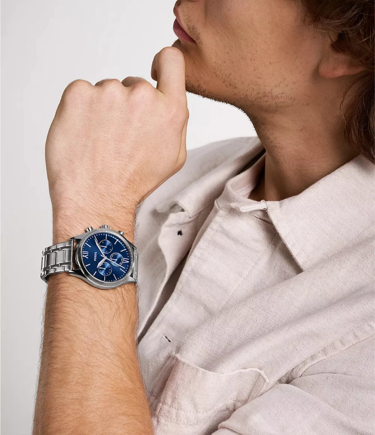 Fossil Fenmore 44mm BQM2808 worn on the wrist, showing the bold case size and blue sunray dial with sub-dials