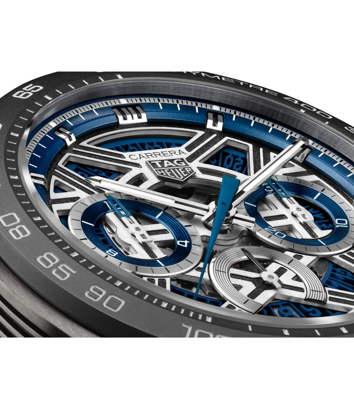Close-up of the fine-brushed rhodium blue skeletonized dial on the TAG Heuer Carrera Chronograph Extreme Sport CBU2081.FT6274 showing open-worked hands with blue lacquered tips