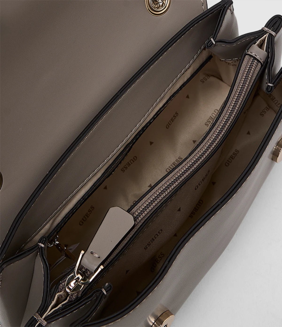 Open view of the Guess Lorelei Convertible Crossbody Flap Bag Dark Taupe HWVG9639210 showing the two-compartment interior divided by a zip pocket