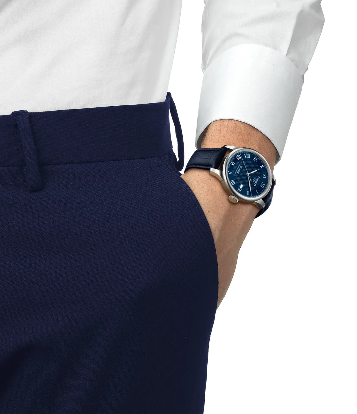 A person wearing the blue leather strap on the Tissot Le Locle 39mm T0064071604300 with butterfly clasp and push-buttons