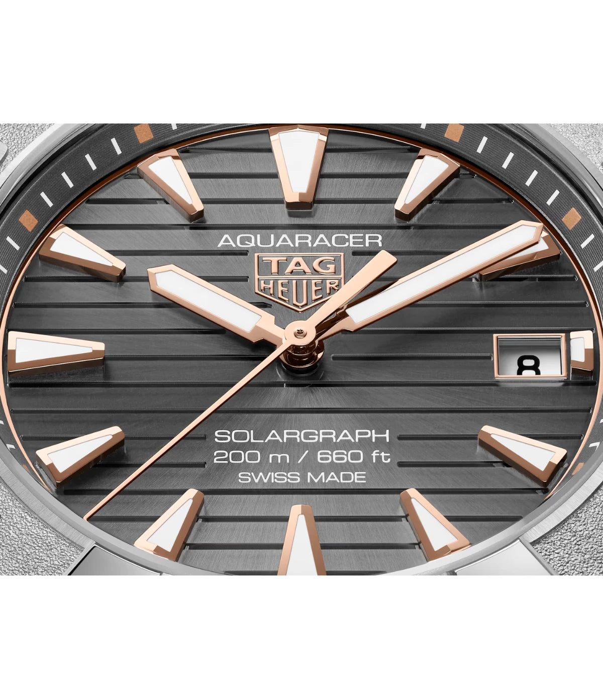 Close-up of the grey sunray brushed dial on the TAG Heuer Aquaracer Professional 200 Solargraph WBP1190.BZ0003 showing rose-gold-plated indexes with Super-LumiNova