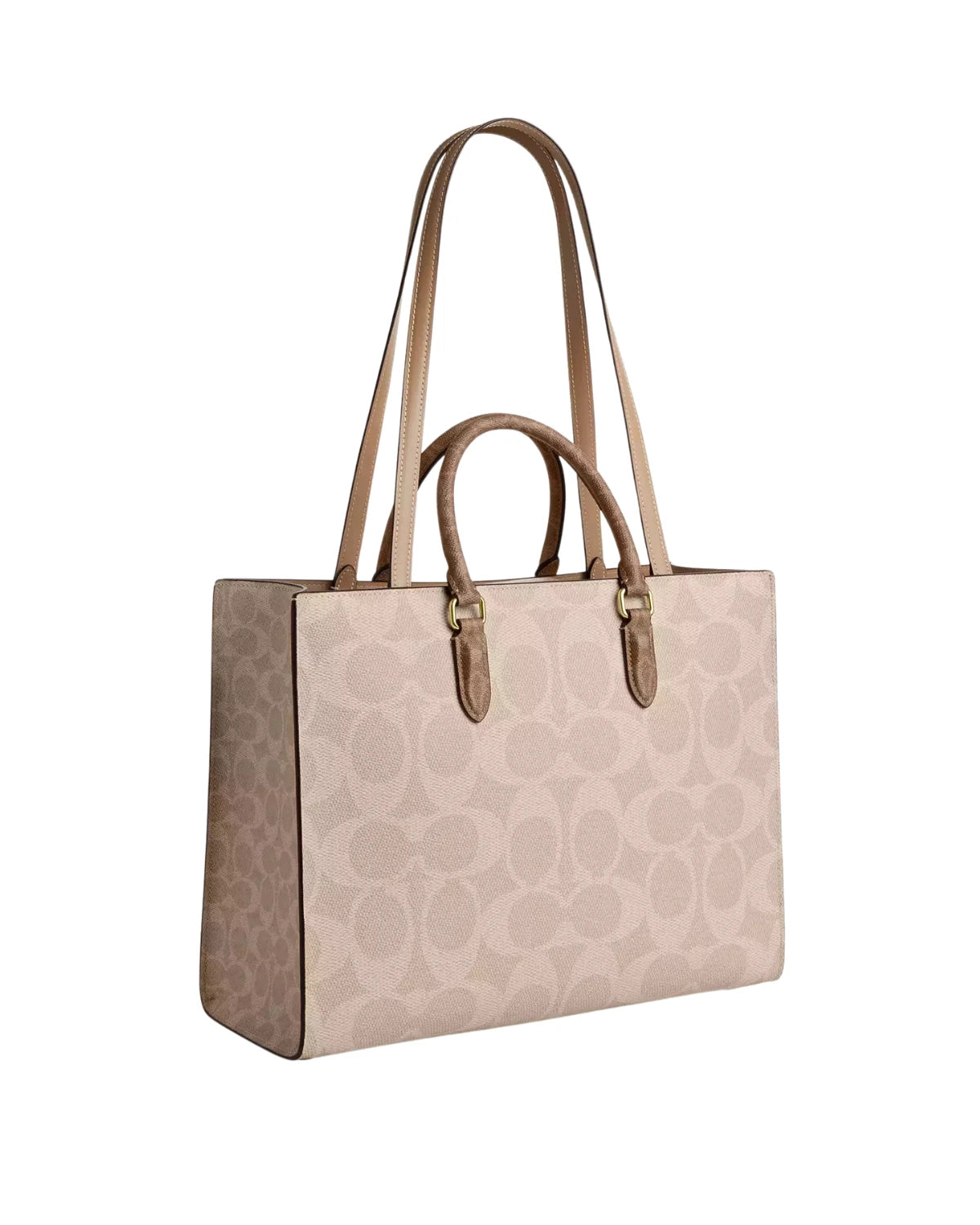 Side profile of the Coach Maggie Tote Bag CY677 showing blocked signature canvas panelling, smooth leather trim and four protective base feet