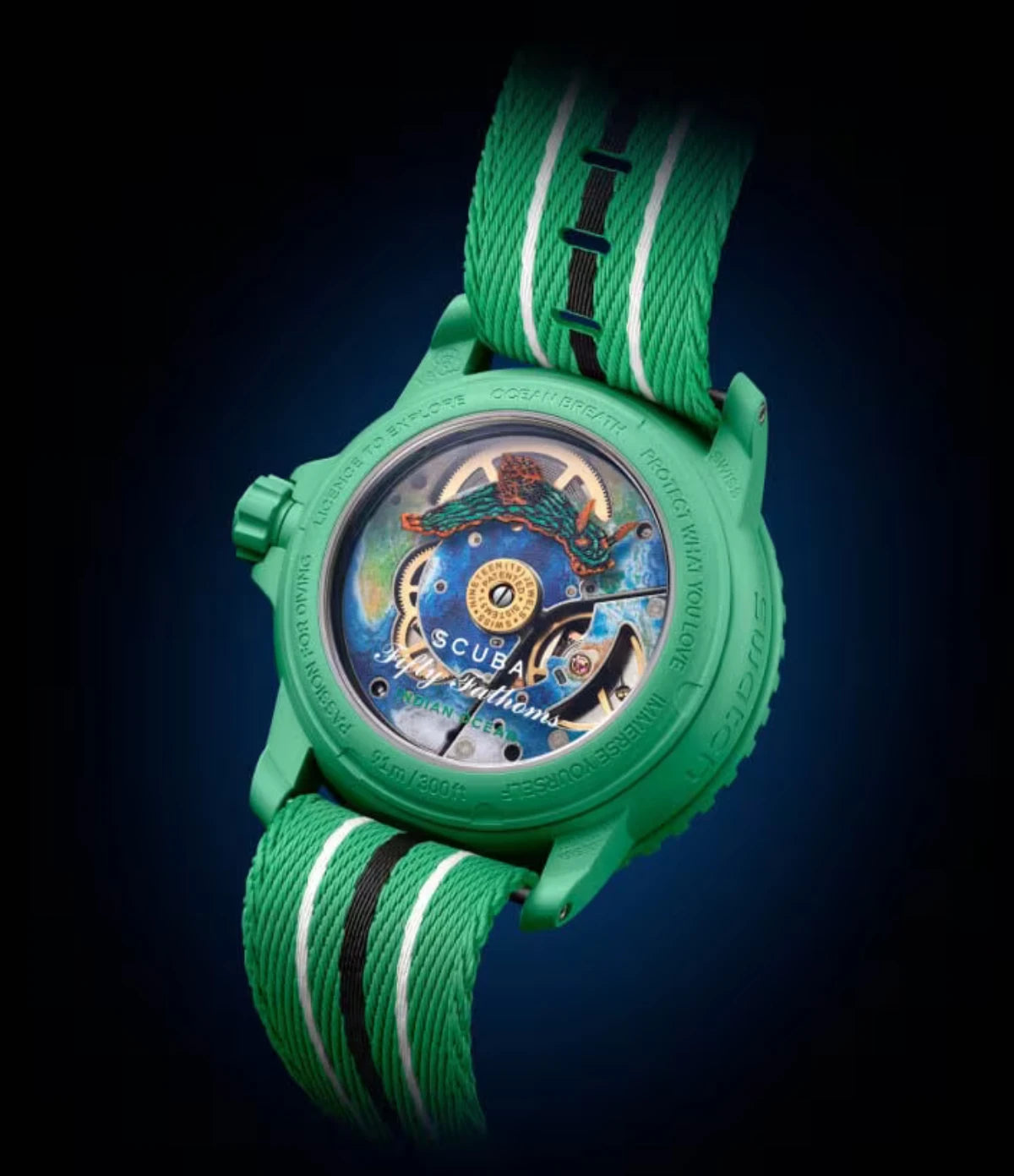 Transparent sapphire caseback of the Blancpain X Swatch Indian Ocean SO35I100C showing the SISTEM51 mechanical movement with Indian Ocean illustration and Nembrotha Kubaryana nudibranch print