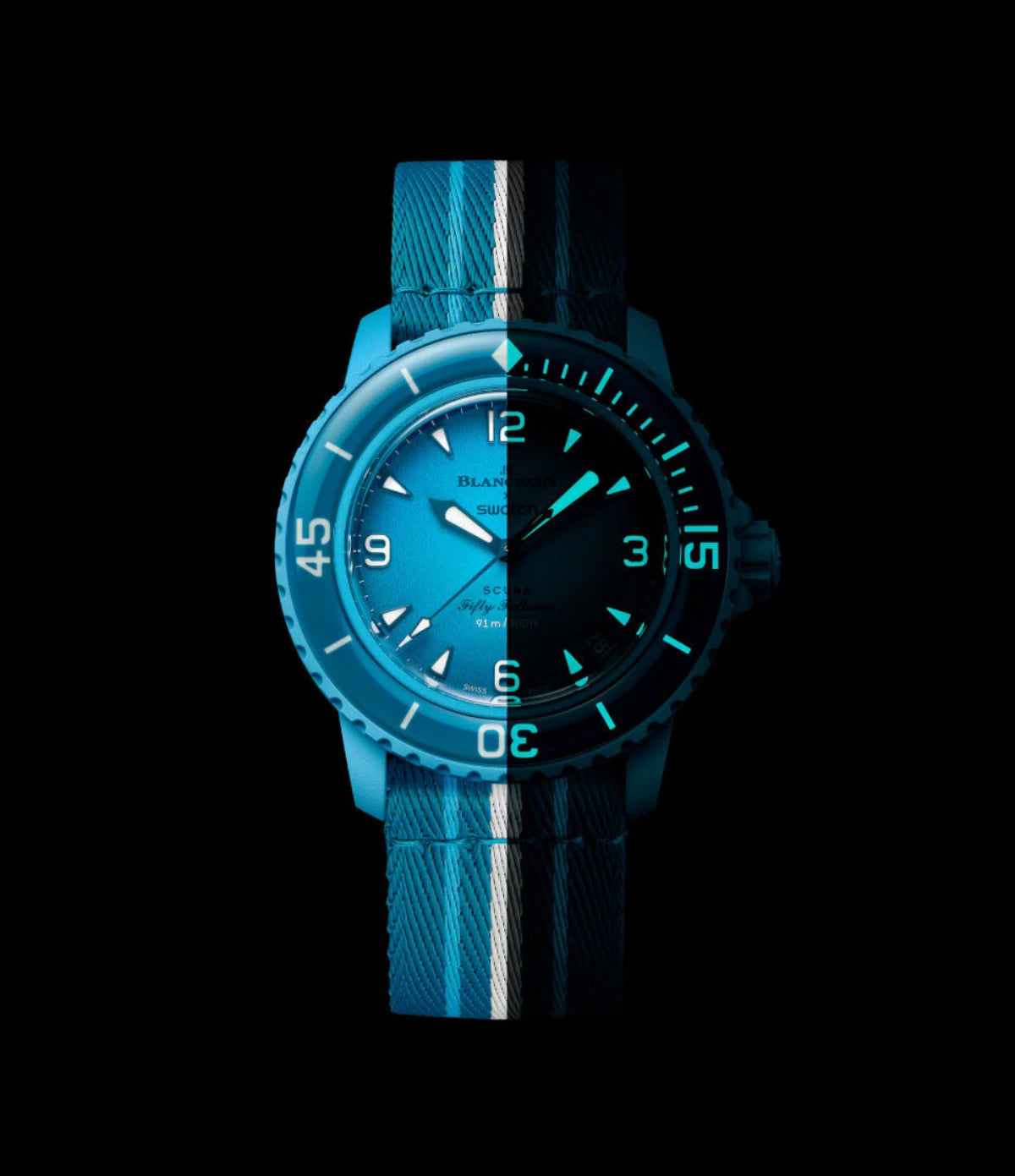 Blancpain X Swatch Blue Lagoon SO35L400 dial glowing in the dark, showing Grade A Super-LumiNova on hour markers, hands and bezel scale