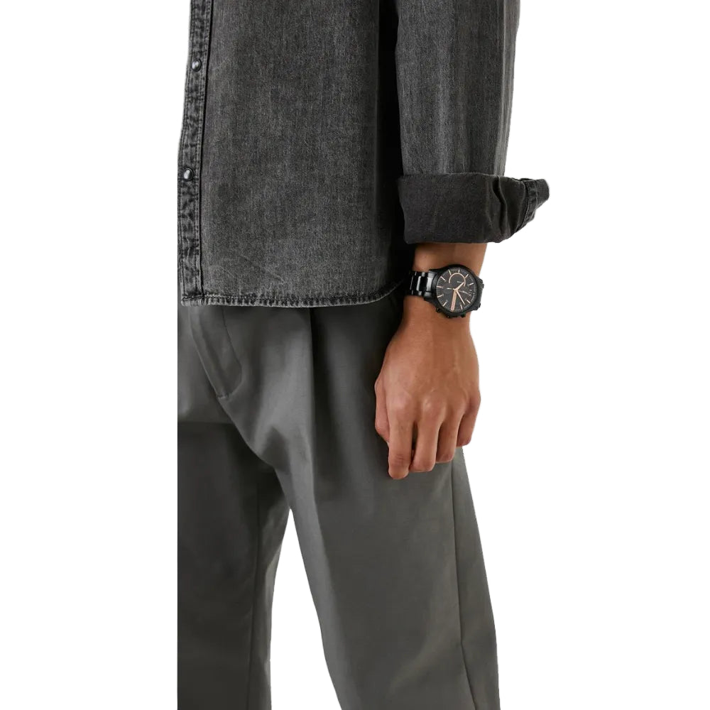 Lifestyle image of a man wearing the Armani Exchange AX2429 chronograph watch to showcase its sleek and versatile design.