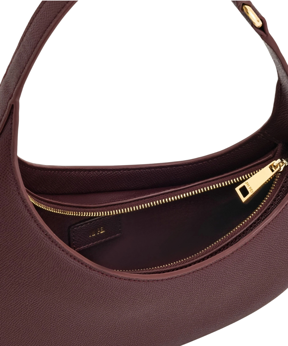 Interior view of the JW PEI Harlee bag in claret, showing the lining and 1 interior slit pocket
