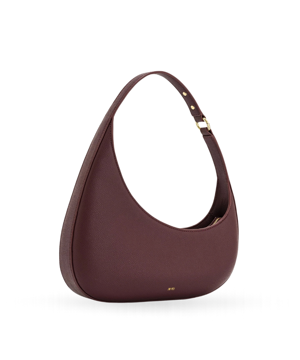 Side profile of the JW PEI Harlee bag in claret, showing its structured silhouette and strap design