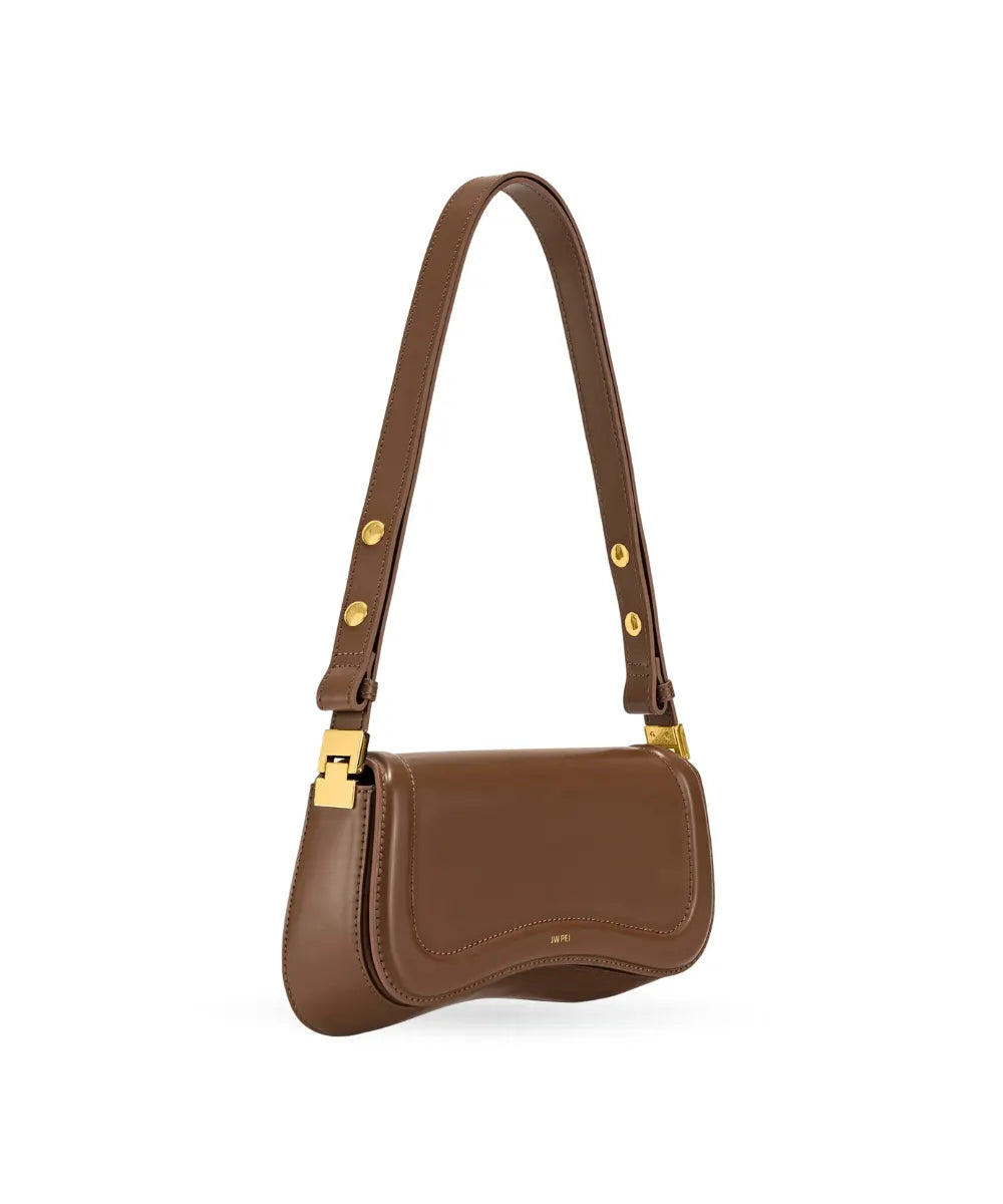 Side profile of the JW PEI Joy bag in brown, showing its structured silhouette and strap design